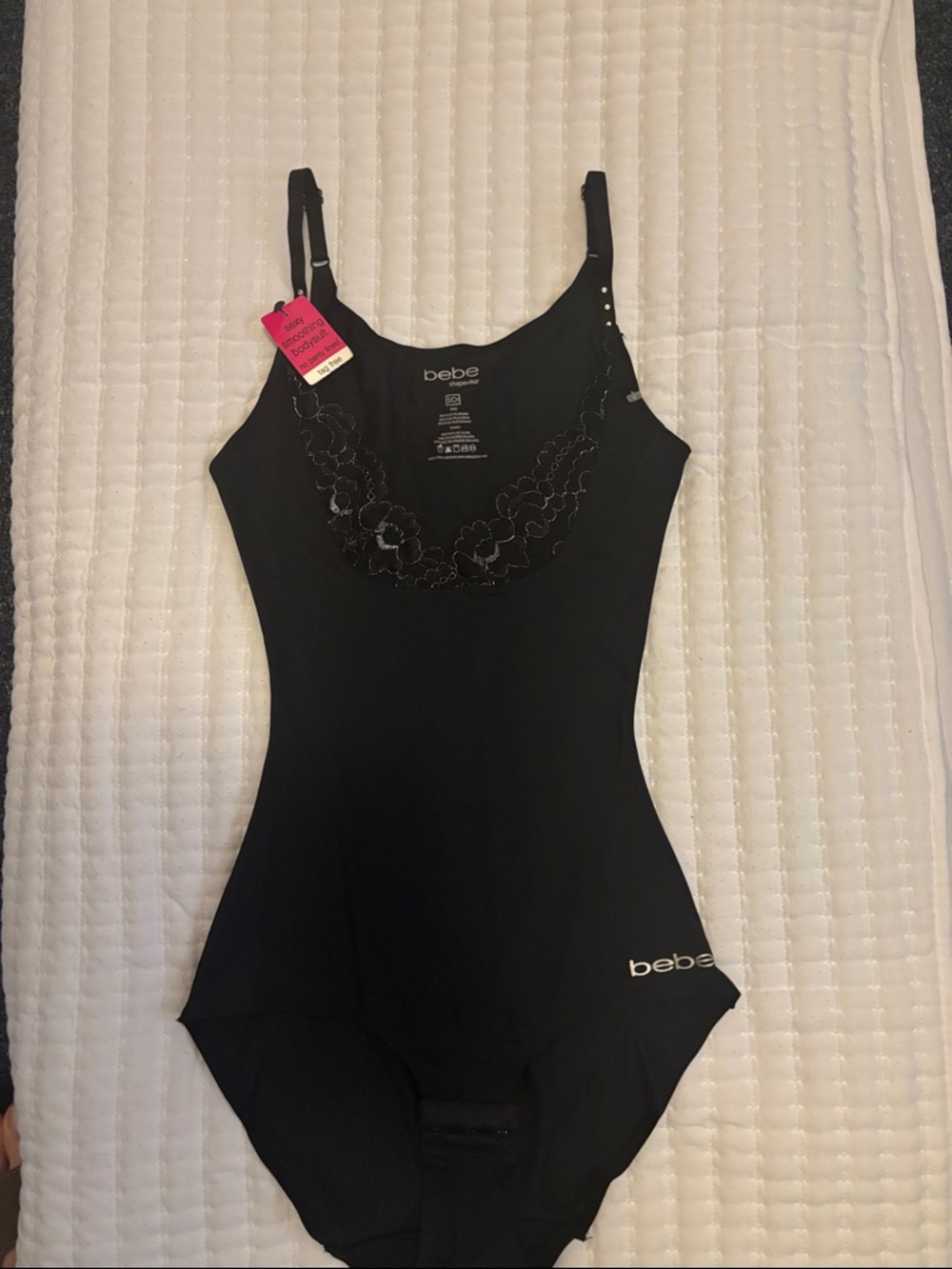bebe Black One-Piece shapewear with Floral Embroidered Neckline.